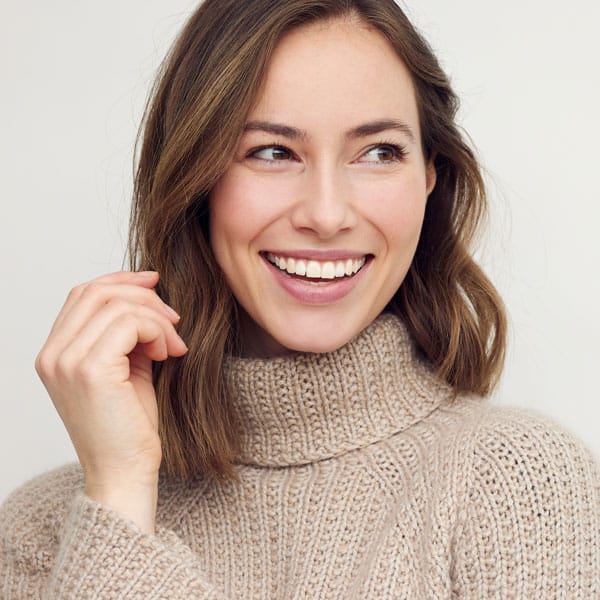 woman looking away and smiling